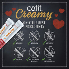 Catit Creamy pris dans la main, récompense ludique.
