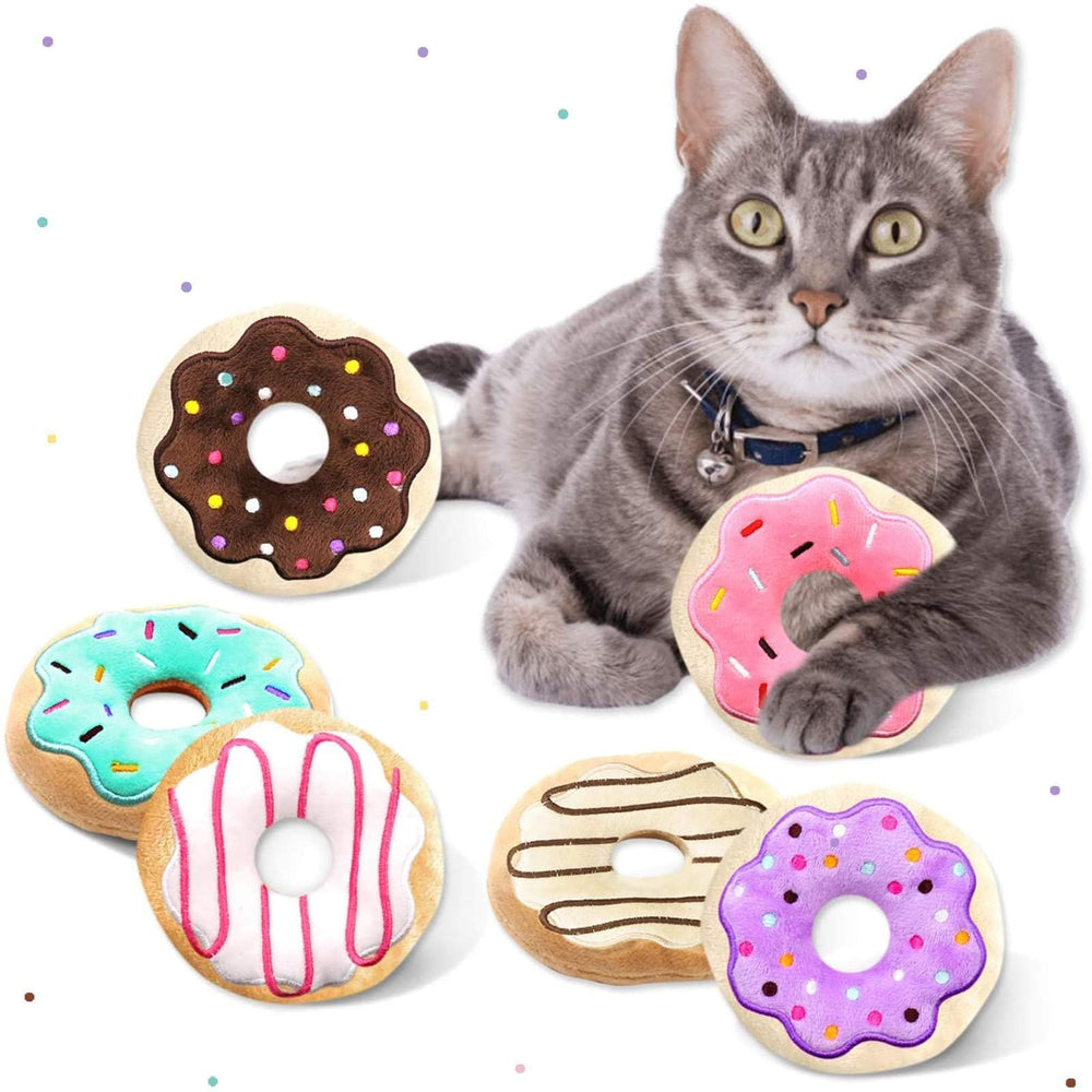 Jouet beignet CiyvoLyeen avec herbe à chat et garnitures colorées pour stimulation sensorielle.