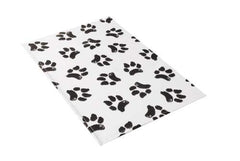 Tapis vétérinaire Ezee~Visit avec patte de chien noir et blanc pour stabilité en clinique.