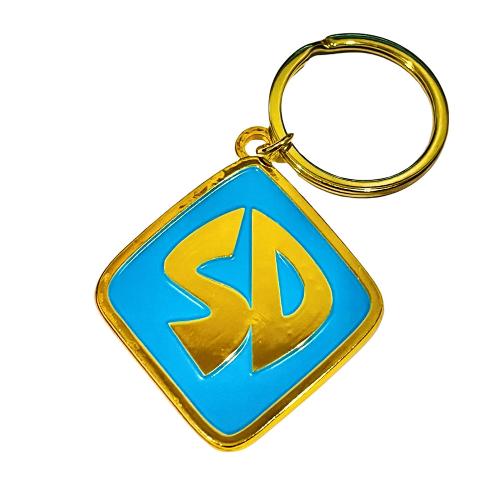ImagineeringDepot collier chien metal premium — fini doré brillant et détails bleus pour un look chic.