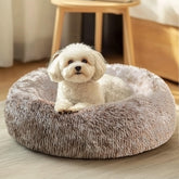 Lit JOLLYVOGUE: coussin en forme de beignet pour un confort enveloppant.