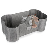 Panier Lukeline en forme d'os pour ranger les jouets du chien, pratique et décoratif.