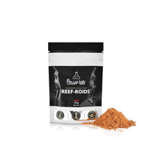 Application de la pâte Reef-Roids avec seringue, alimentation ciblée des polypes.