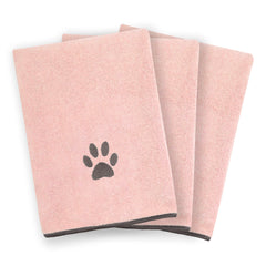 Logo Ritz brodé sur serviette animale, allure durable après lavage.