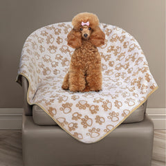 Couverture Stuffed, imprimé patte sur le dessus, idéale pour des câlins chaleureux.