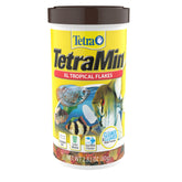 Flocons TetraMin XL tropicaux dans une bouteille, nutrition complète pour poissons tropicaux.