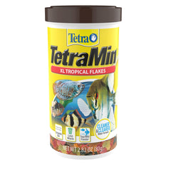 Flocons TetraMin XL tropicaux dans une bouteille, nutrition complète pour poissons tropicaux.