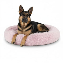 The Dog's Balls lit-donut-rose-36 offre un espace de repos réconfortant pour chiens.