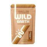 Gourmandises végétales Wild Earth pour chiens en bouchées colorées.