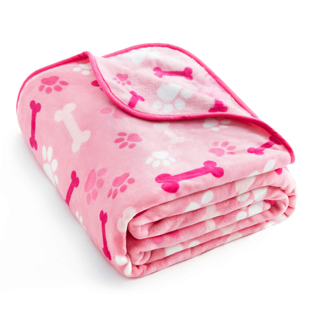 Couverture Allisandro avec design patte rose, douceur idéale sur le canapé.