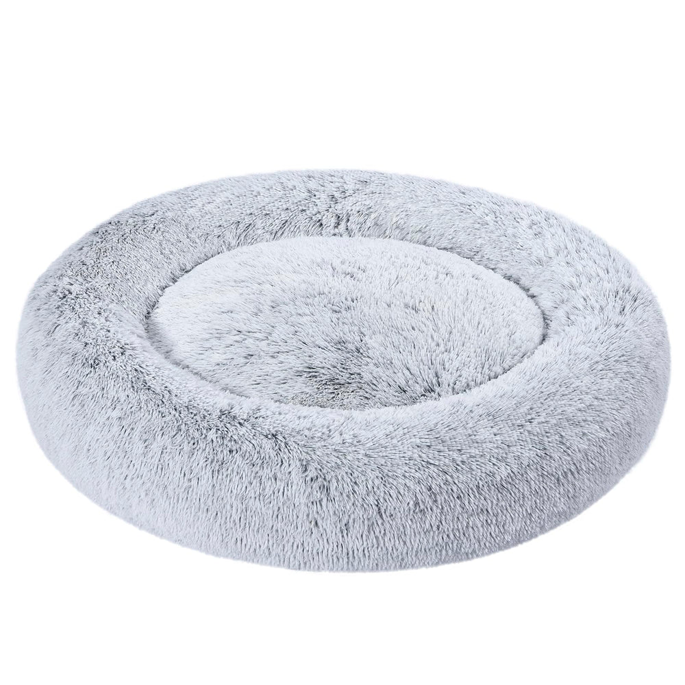 Amazon Basics lit donut en peluche gris pour chien offrant un cadre douillet.