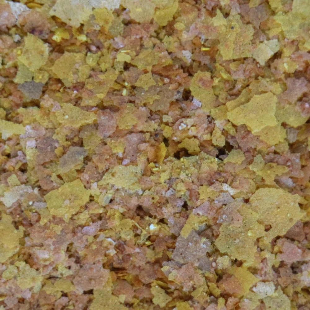 API GOLDFISH FLAKES: flocons avec ail et levure pour nutriments essentiels.