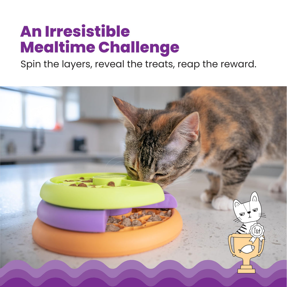 Catstages Kitty Lickin' Layers, tours rotatives révélant des récompenses pour chats actifs.