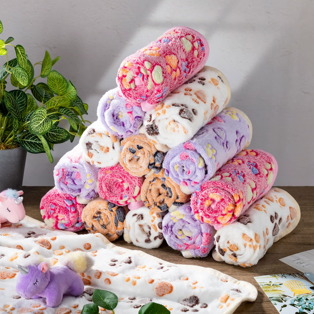 Couverture Chumia imprimée de pattes, ajout ludique et réconfort pour les animaux.