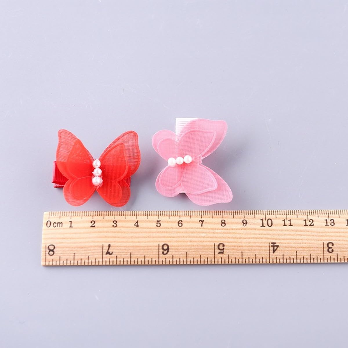Attache papillon perle de Cuchenhuan adaptée aux chiens et chats.