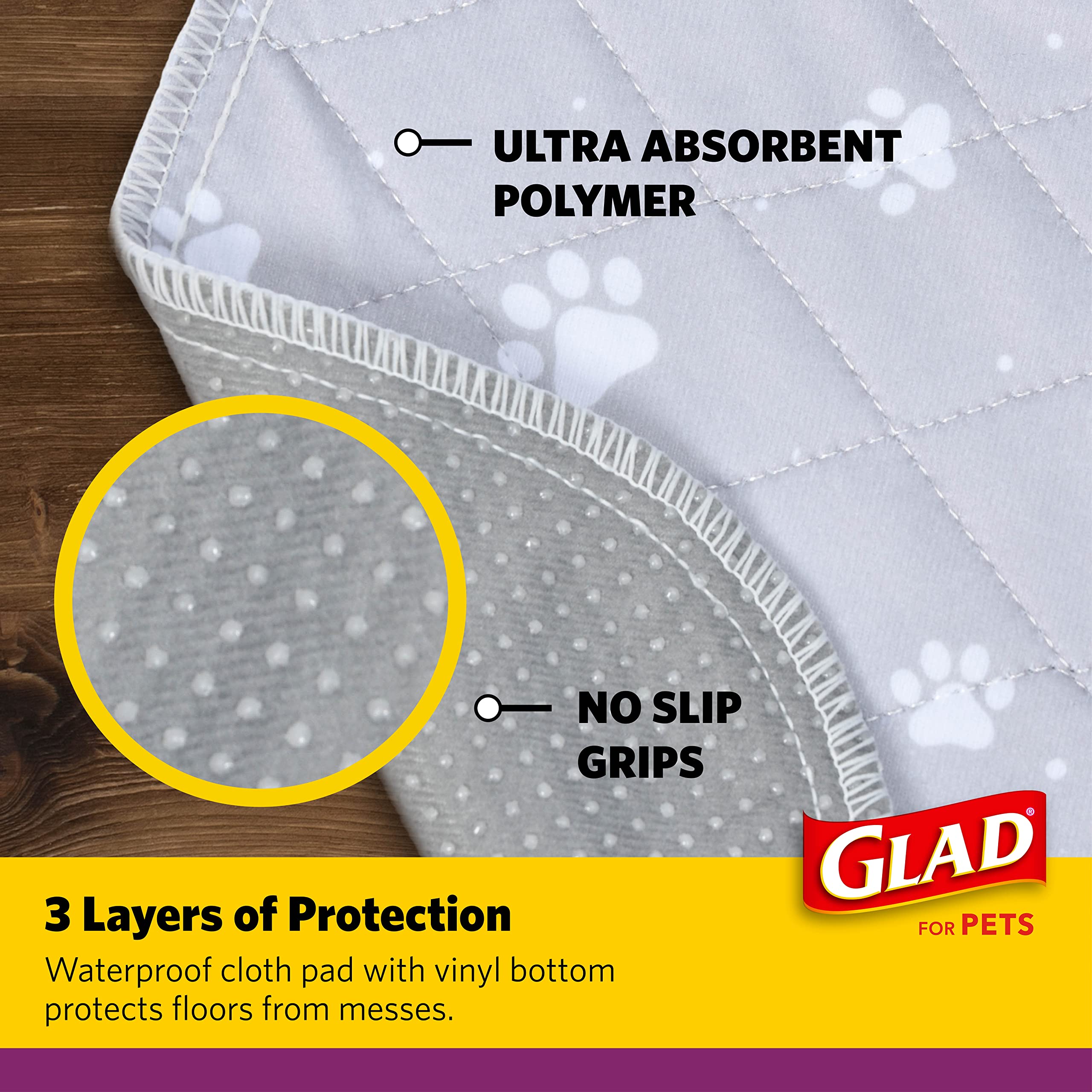 GLAD motif patte gris sur tapis, design doux.