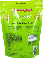 Chien heureux dégustant le biscuit bio Grandma Lucy's et savoureux.
