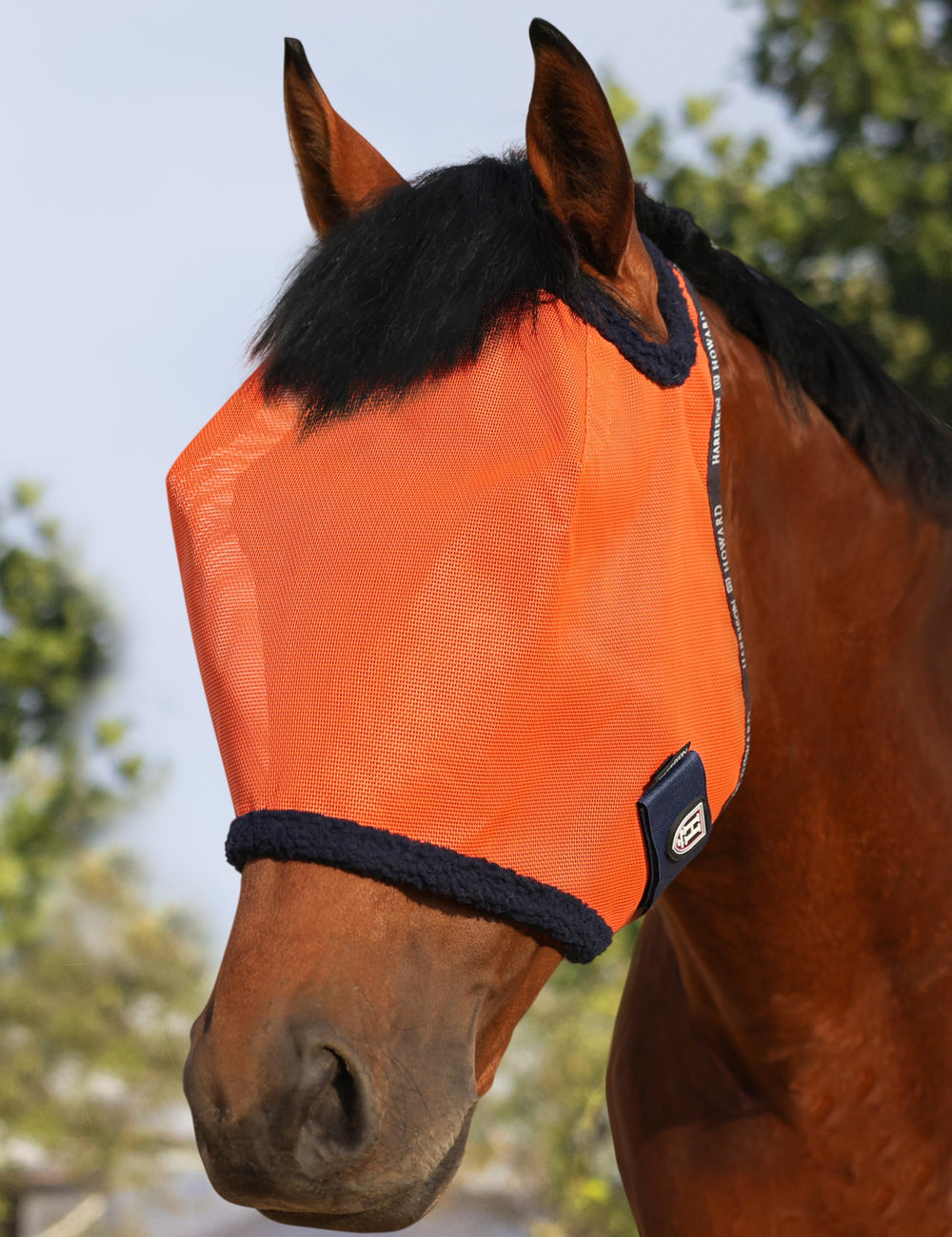 Masque Harrison Howard en maille UV orange pour cheval, protection légère et respirante.