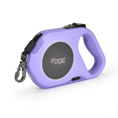 Laisse rétractable Hounds & Pups avec lumière LED violet pour sorties nocturnes.