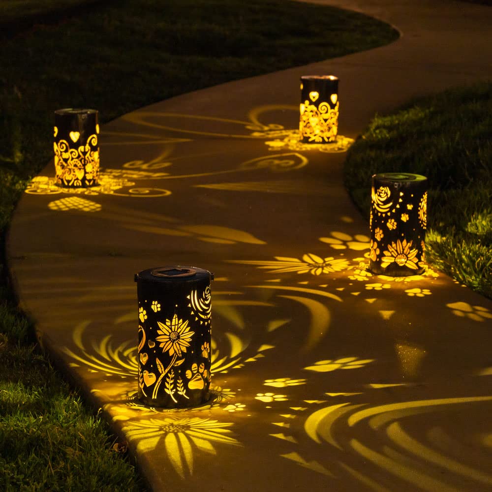 Projection au sol des motifs soleil-tournesols-pattes lumineux.