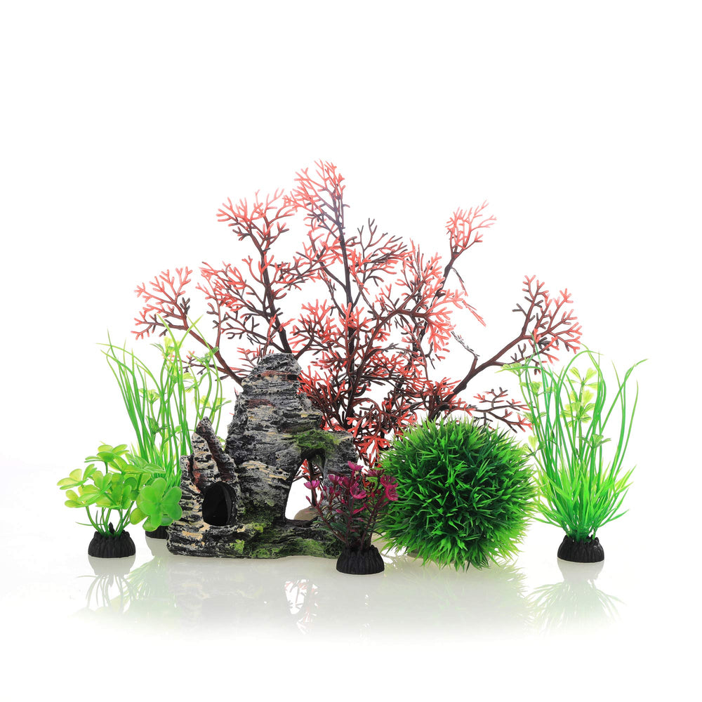 Décor JIH Aquarium: plantes plastiques et grotte rocheuse pour créer un habitat sûr et naturel.