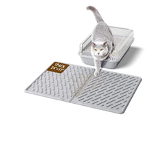 Tapis kaxionage avec rainures pour retenir les éclats de litière.
