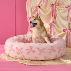 Lit rond LE SURE rose peluche, confort moelleux pour chiens et chats.