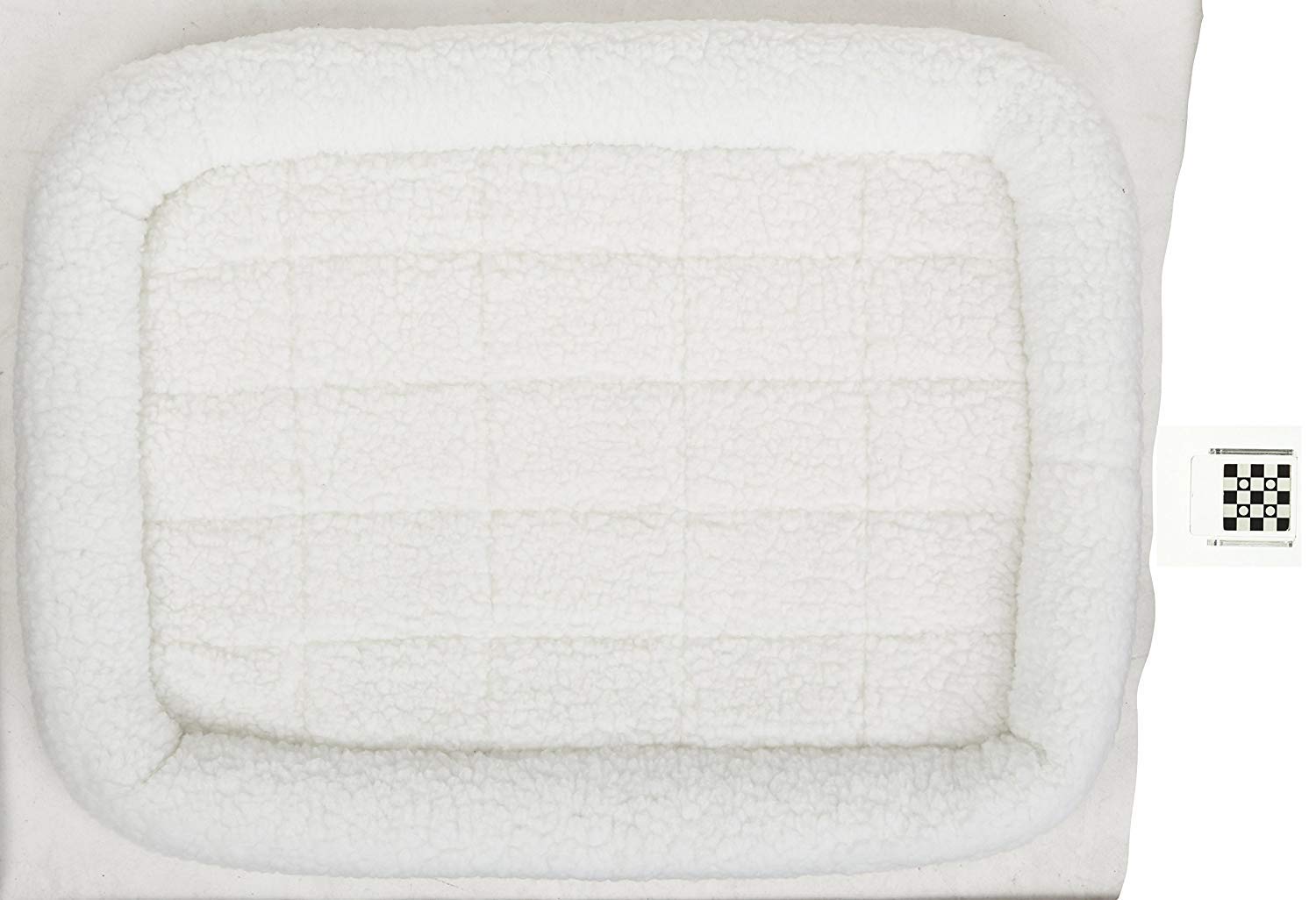 Coussin blanc QuietTime, discrétion et masquage des poils dans la pièce.