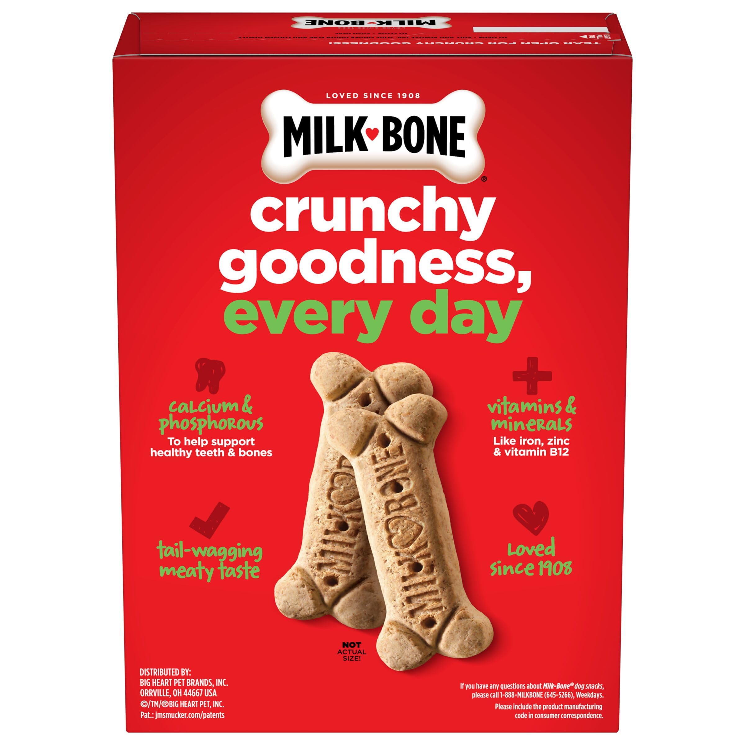 Chien heureux recevant Milk-Bone Original comme récompense.