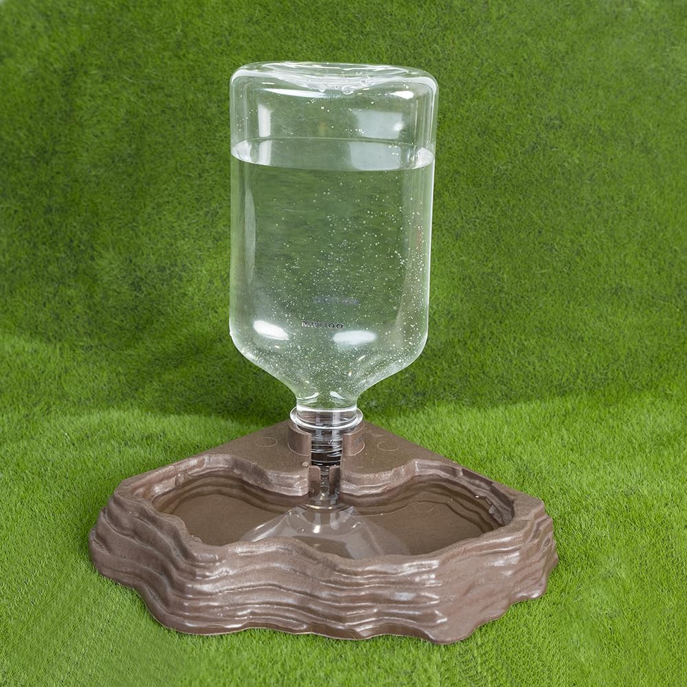 MRTIOO design-roche-simulee-terarium: intégration discrète derrière des plantes artificielles.