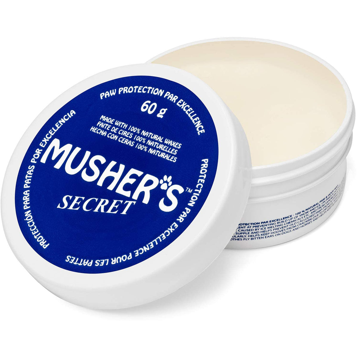 Pommade Mushers Secret sur patte chien — hydratation et protection.