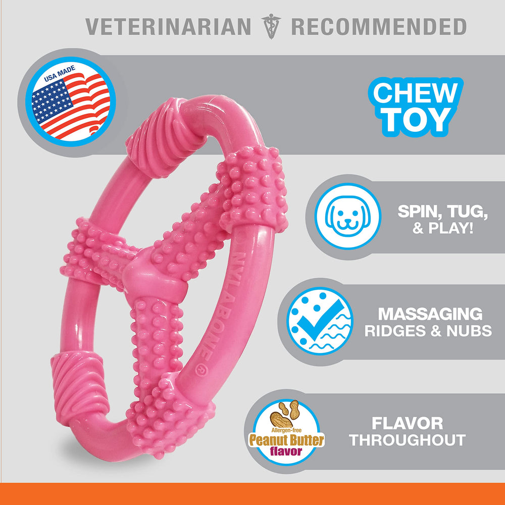 Nylabone Spin Tug & Play, anneau rose pour chiots, activité et curiosité accrues.
