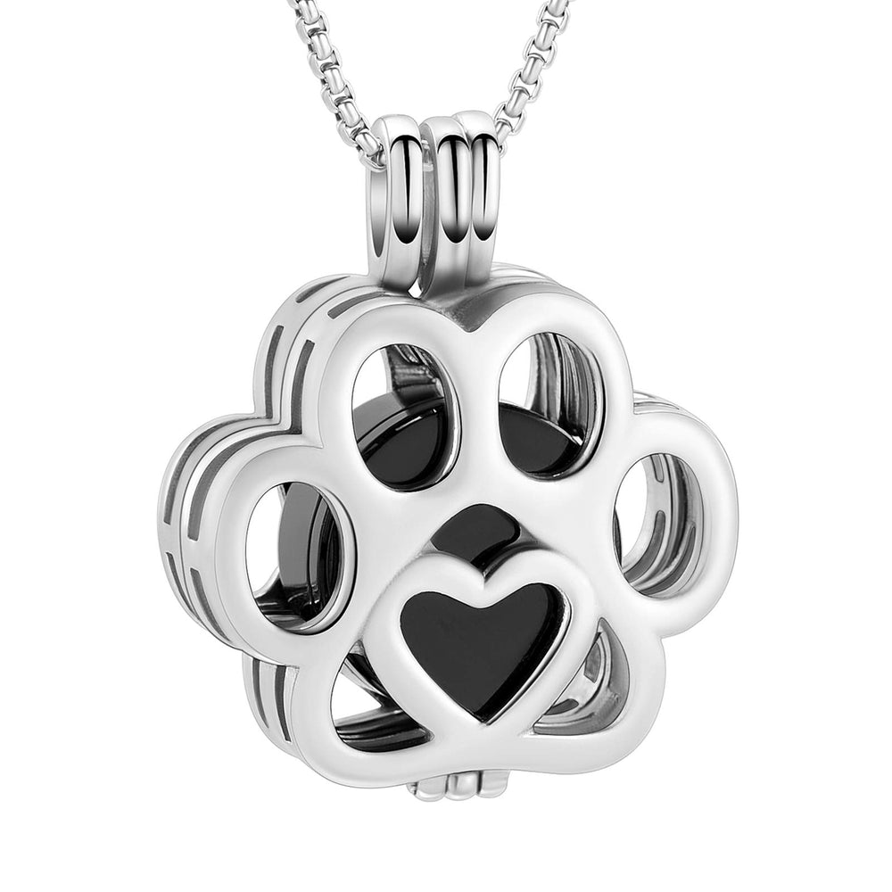 Pendentif urne Oinsi pour animaux en argent noir près du cœur.