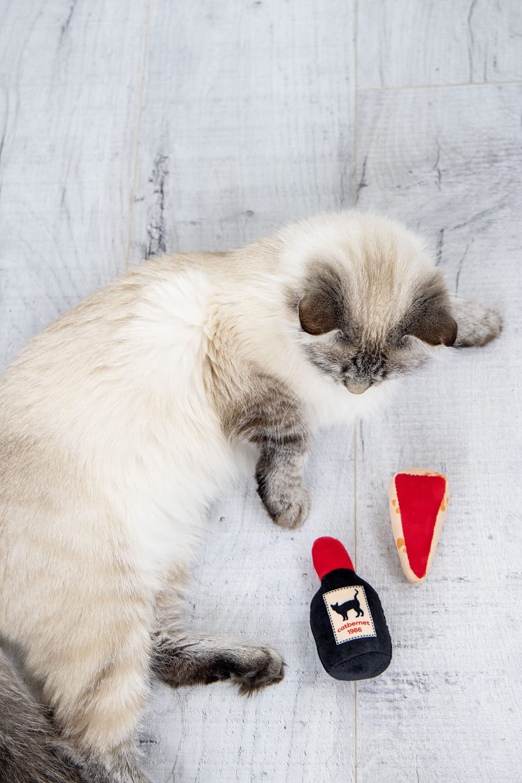 Pearhead chat vin joue bouteille crissante : sons qui encouragent la chasse et le jeu.