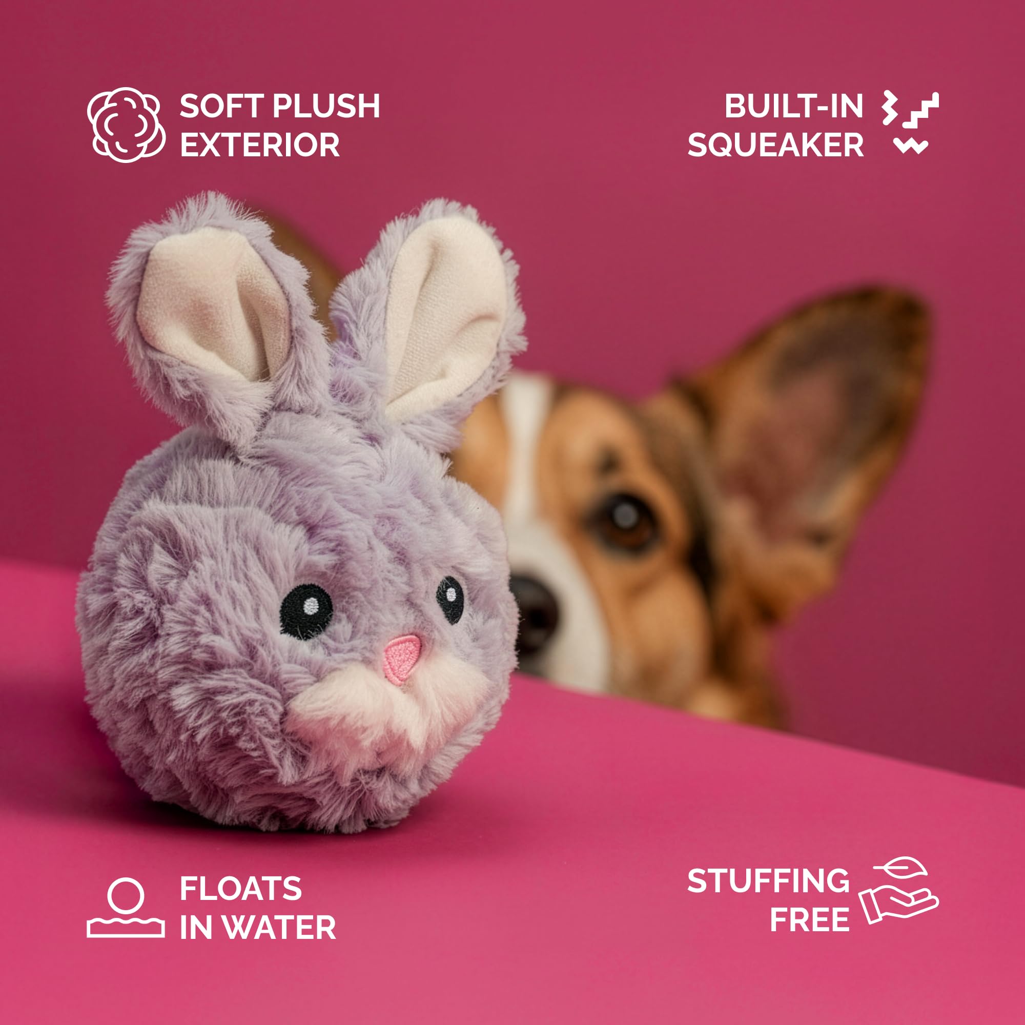 Balle peluche rose Pet Lou avec sifflet intégré, idéale pour les jeux de poursuite.