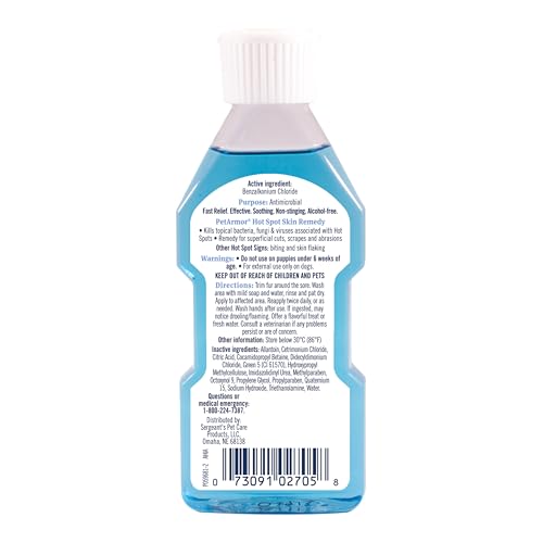 Application ciblée du remède PetArmor sur le point chaud du chien.