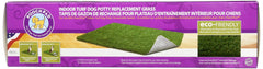 PoochPad utilisé comme tapis potty intérieur, drainage rapide.