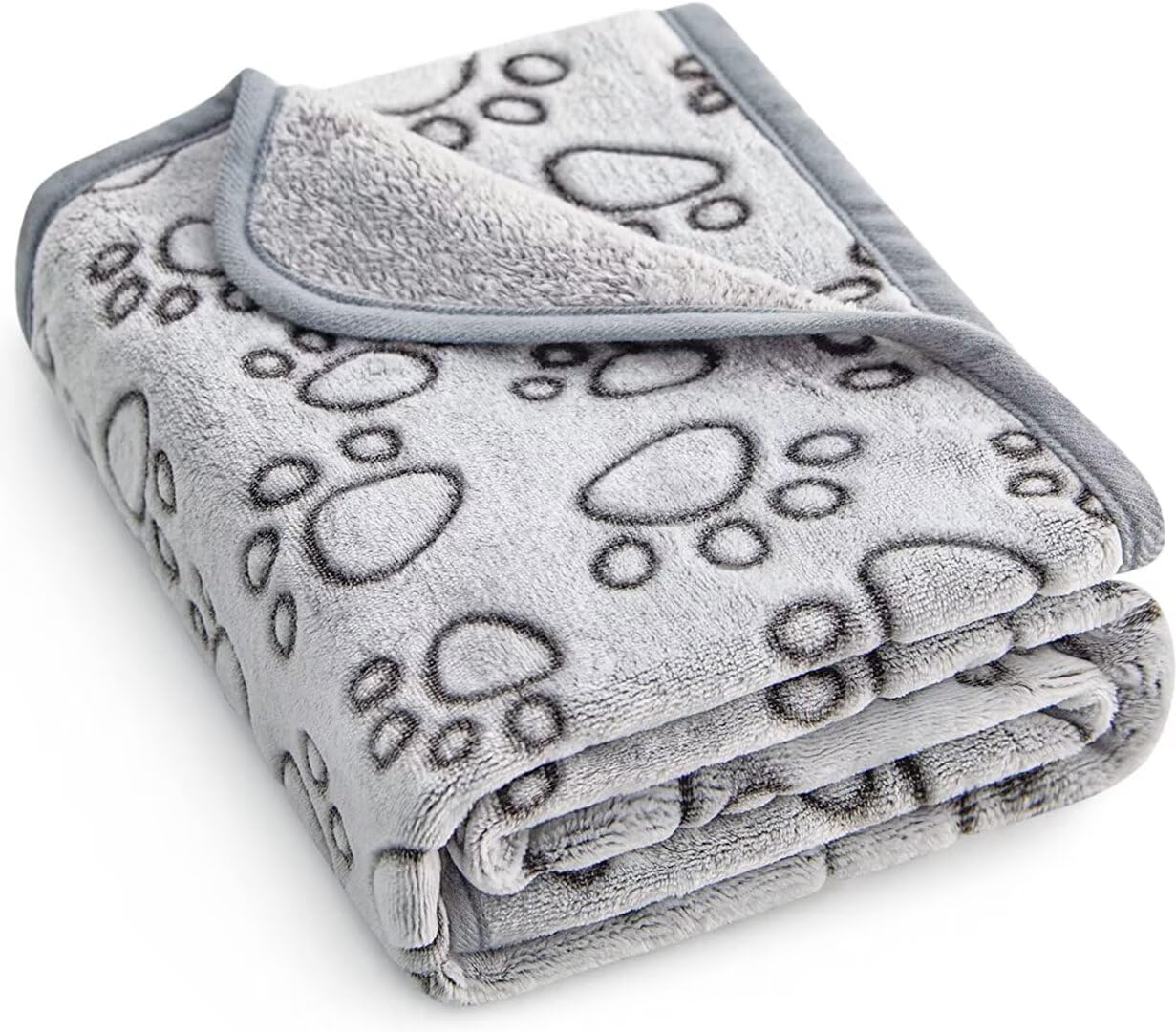 Couverture Stuffed avec empreintes sur le dessus, idéal pour des câlins doux.