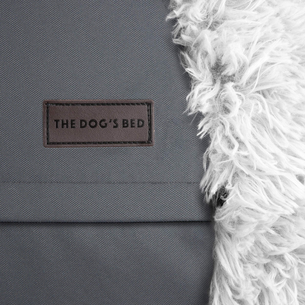 The Dog’s Balls Donut Bed — lavage en machine, hygiène simple.