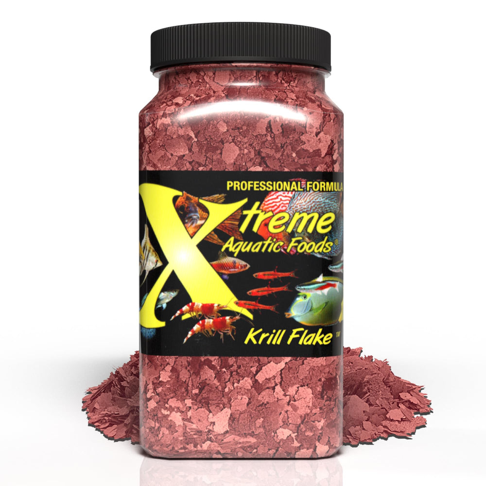 Xtreme Krill Flakes dans un bocal, flocons riches en krill pour couleur et énergie des poissons.
