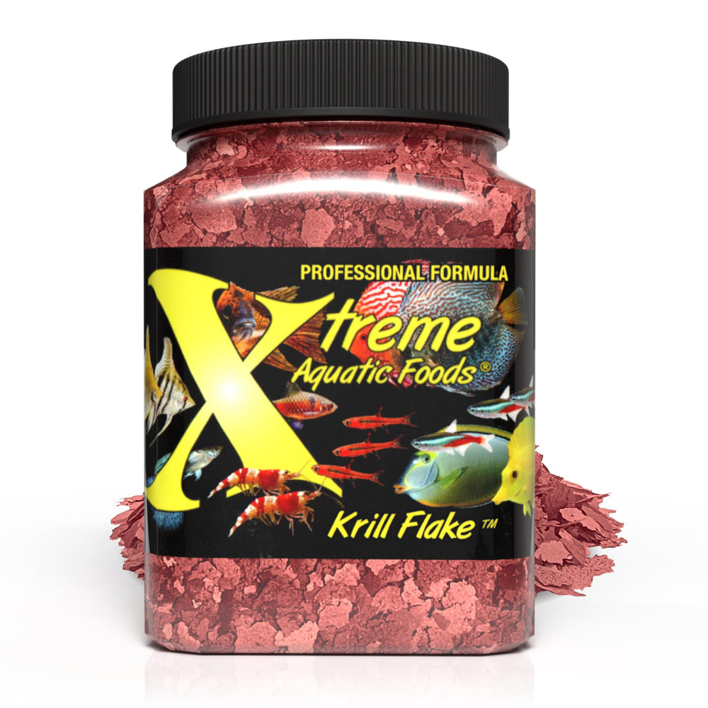 Xtreme Krill Flakes versement bouteille pour nourrir précisément les poissons.